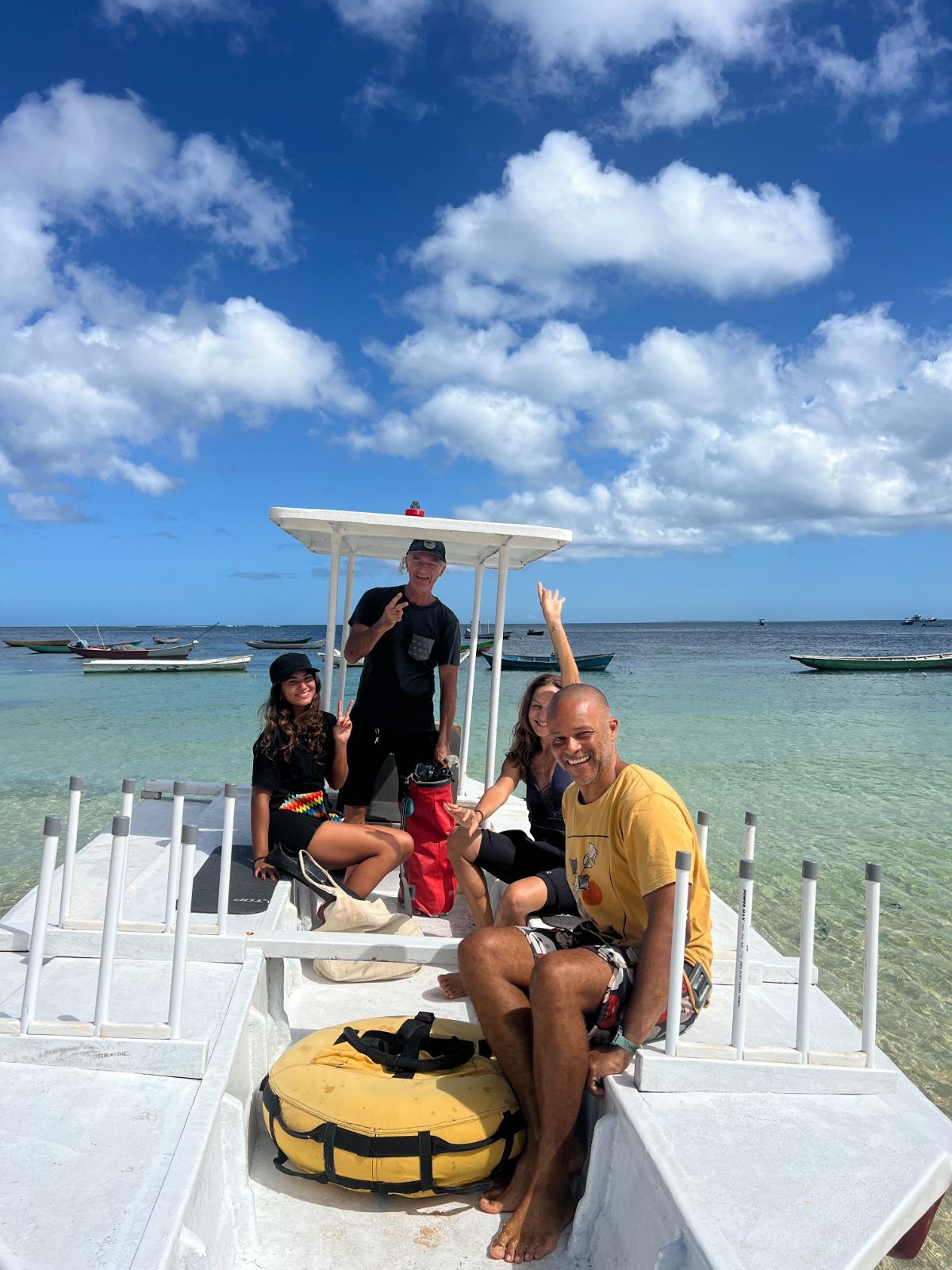 A small group on the boat jetty before a guided excursion