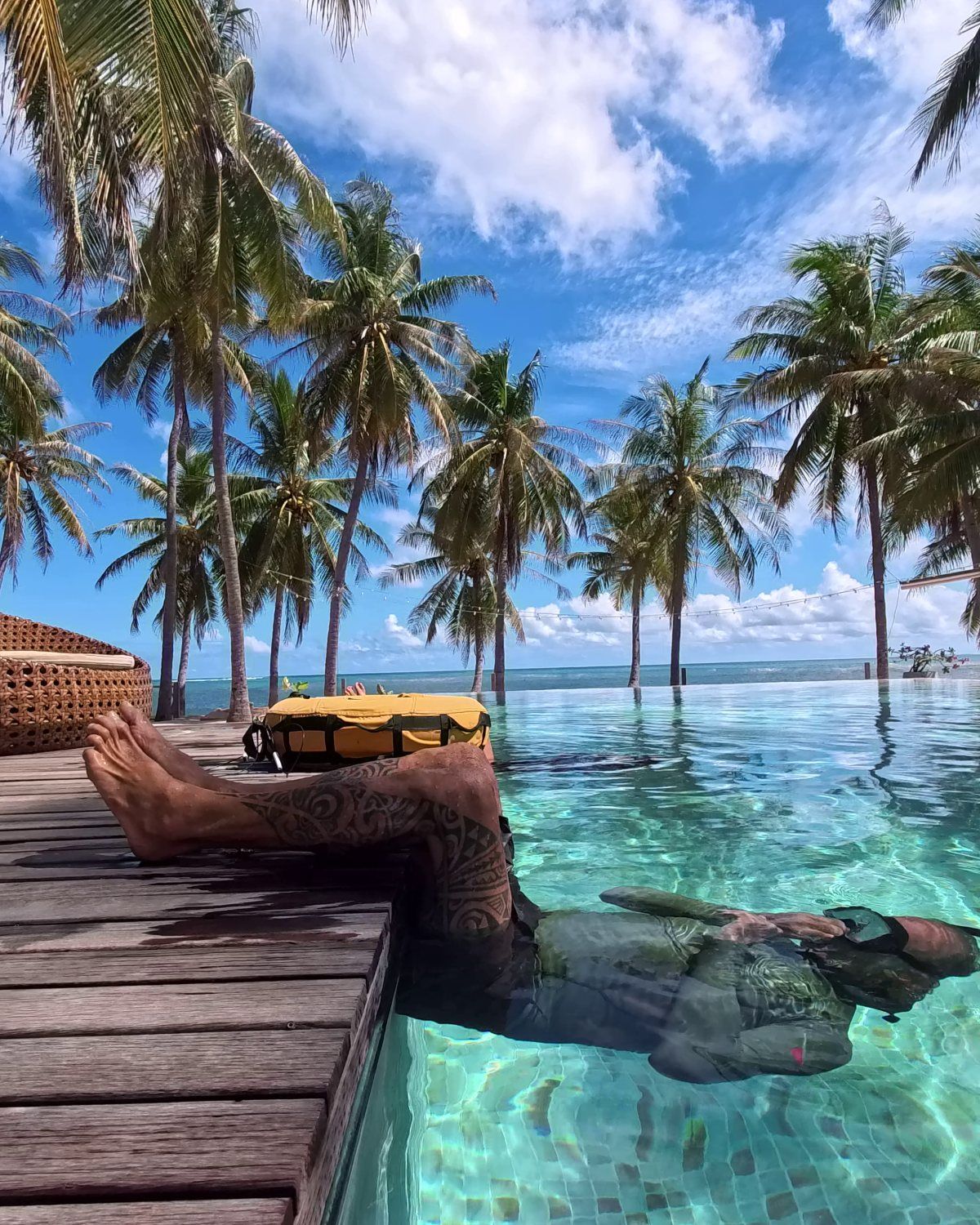 Resting in the pool under the palms after a session, looking out to the reef